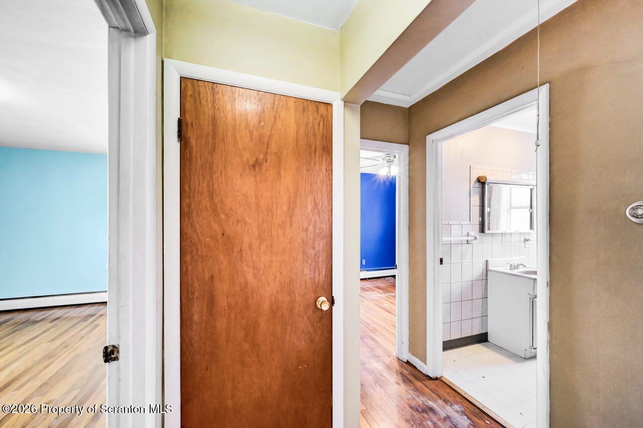 703 Ohara Street Scranton, PA 18505 - Photo 15 of 36 a bathroom with a glass shower door and a sink