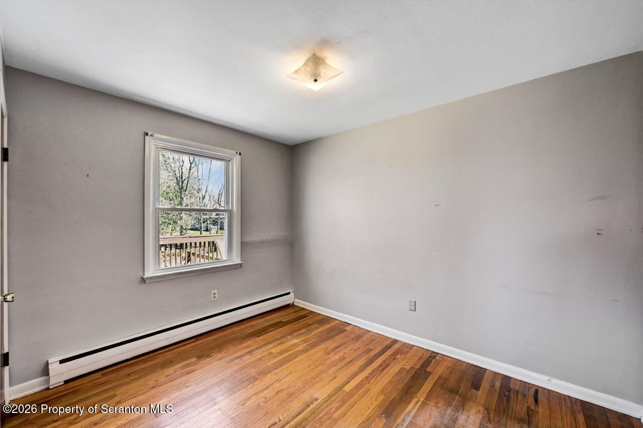 703 Ohara Street Scranton, PA 18505 - Photo 19 of 36 an empty room with a window