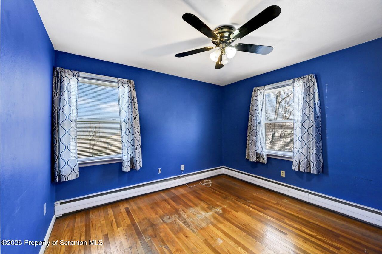 703 Ohara Street Scranton, PA 18505 - Photo 24 of 36 a view of room with window and wooden floor