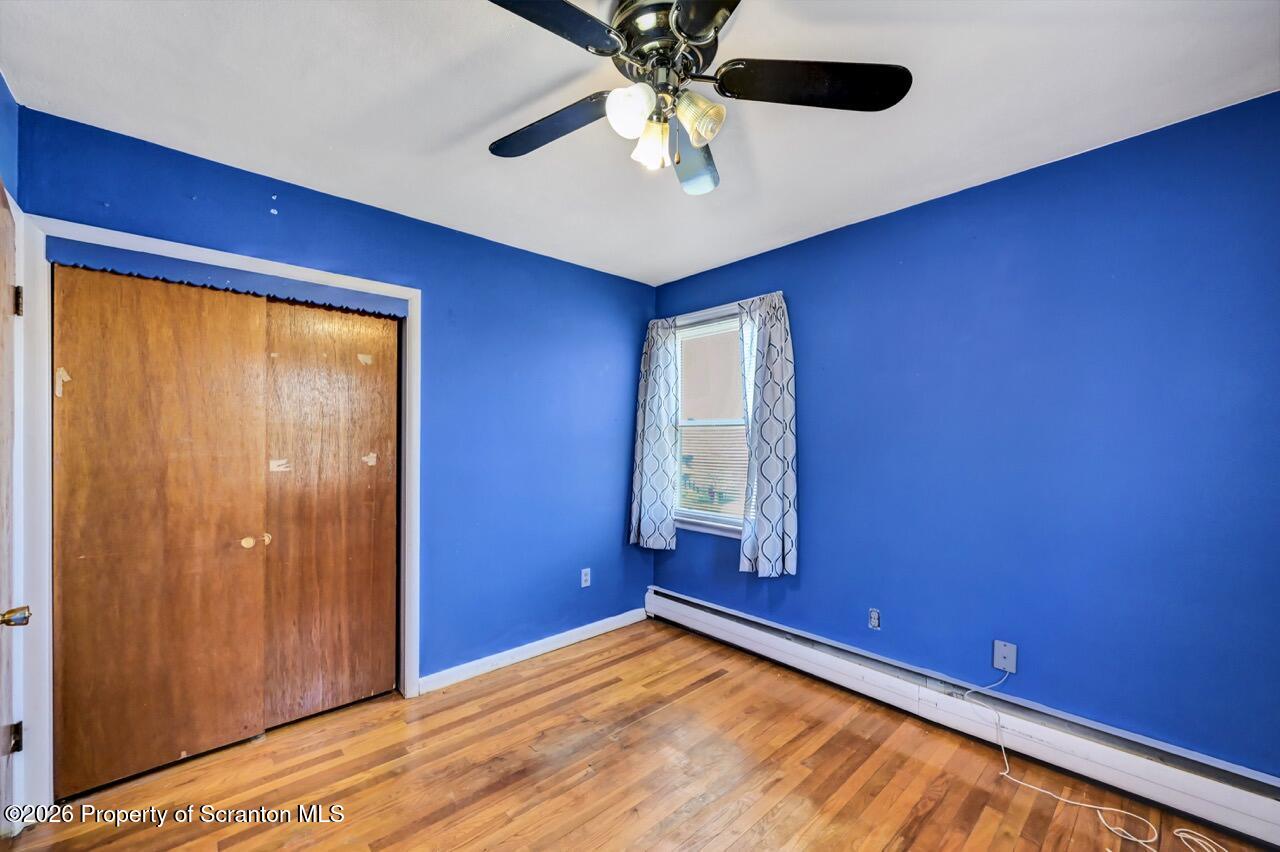 703 Ohara Street Scranton, PA 18505 - Photo 25 of 36 a view of empty room with a window and a ceiling fan