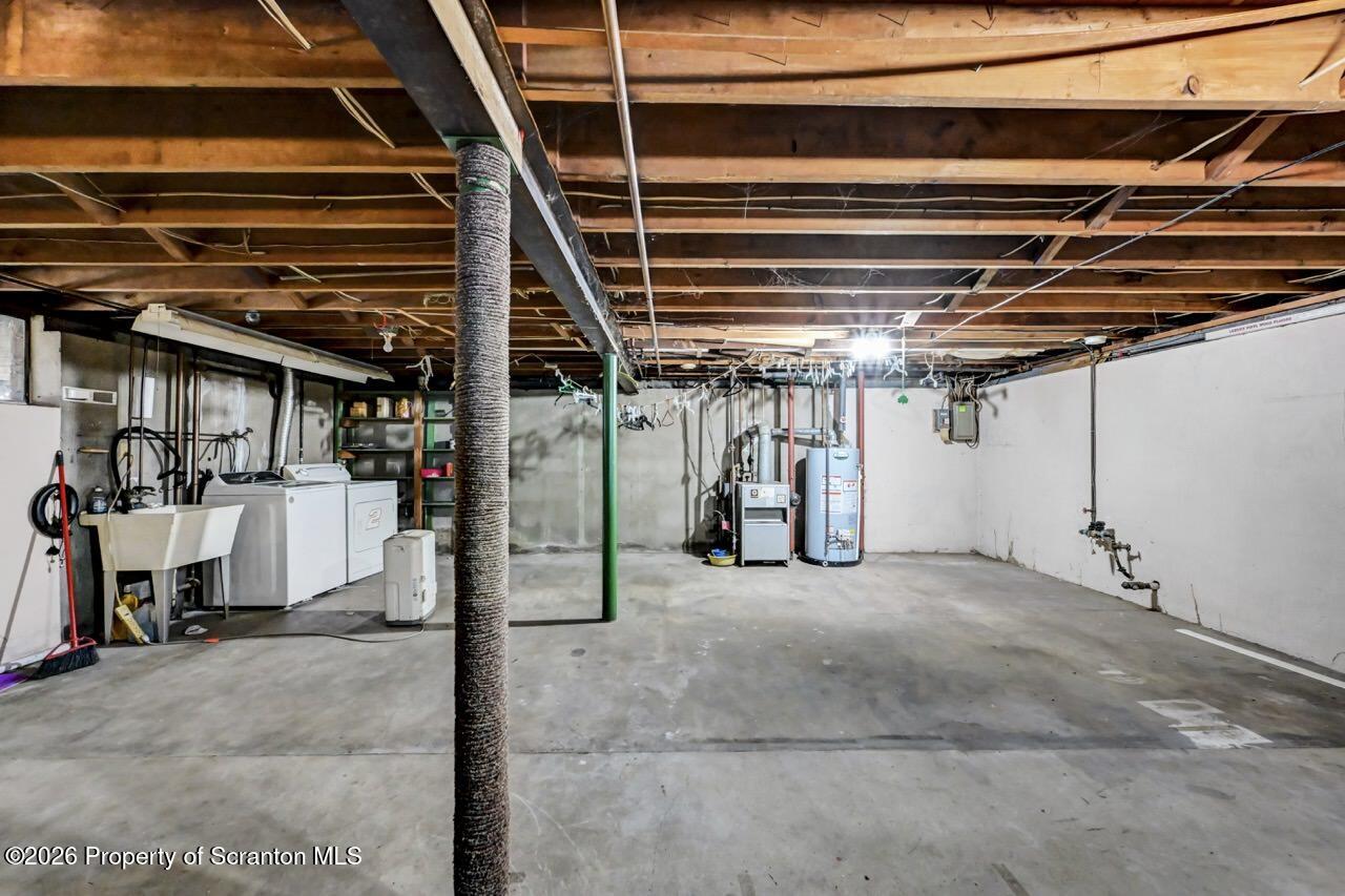 703 Ohara Street Scranton, PA 18505 - Photo 27 of 36 a view of empty room with wooden stairs