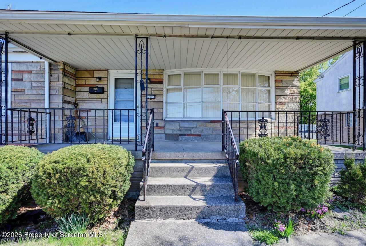 703 Ohara Street Scranton, PA 18505 - Photo 3 of 36 a view of a porch with a bench