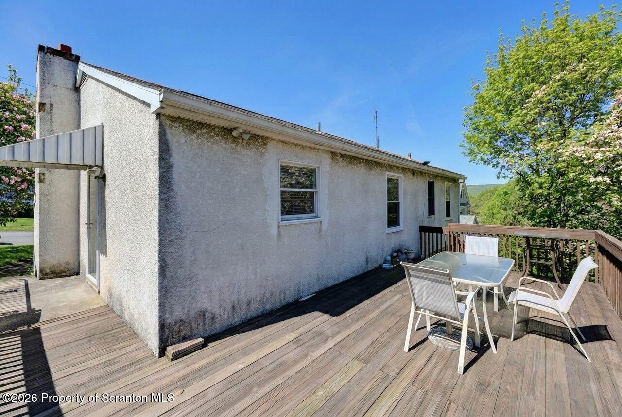 703 Ohara Street Scranton, PA 18505 - Photo 32 of 36 a balcony with table and chairs