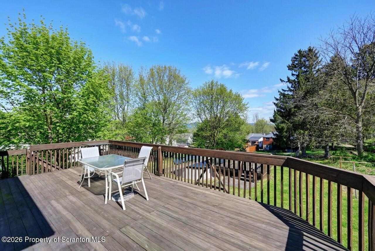 703 Ohara Street Scranton, PA 18505 - Photo 33 of 36 a view of a chairs and table on the deck