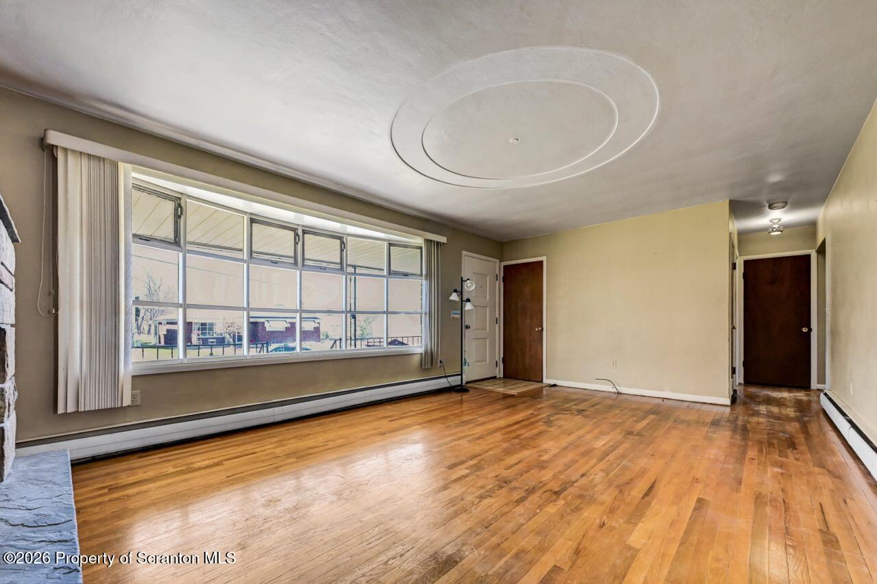 703 Ohara Street Scranton, PA 18505 - Photo 5 of 36 a view of an empty room and a window