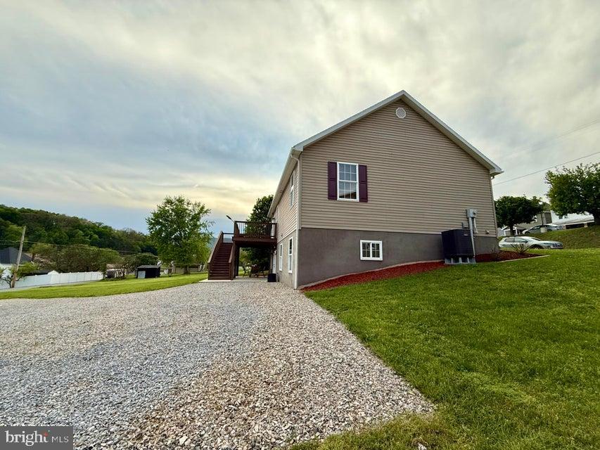 911 Lower Main Street Saxton, PA 16678 - Photo 11 of 63 a view of backyard of house with outdoor seating and barbeque oven