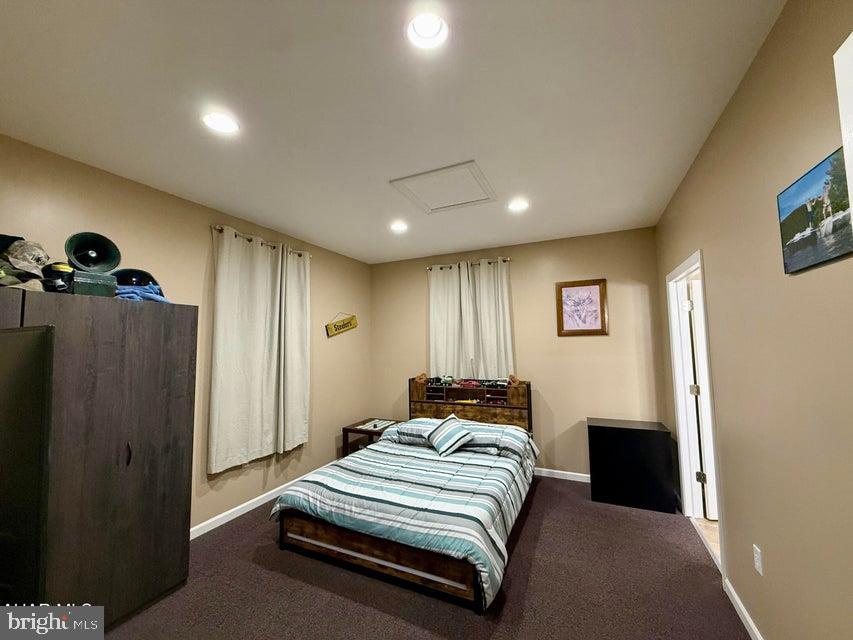 911 Lower Main Street Saxton, PA 16678 - Photo 20 of 63 a spacious bedroom with a bed and a painting on the wall