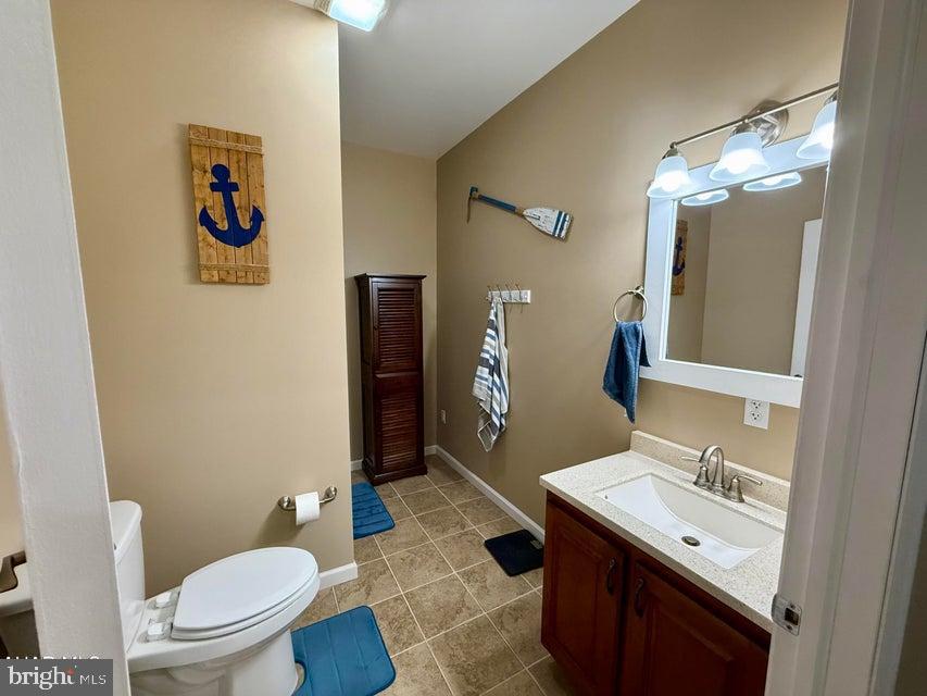 911 Lower Main Street Saxton, PA 16678 - Photo 23 of 63 a bathroom with a sink a toilet a mirror and shower