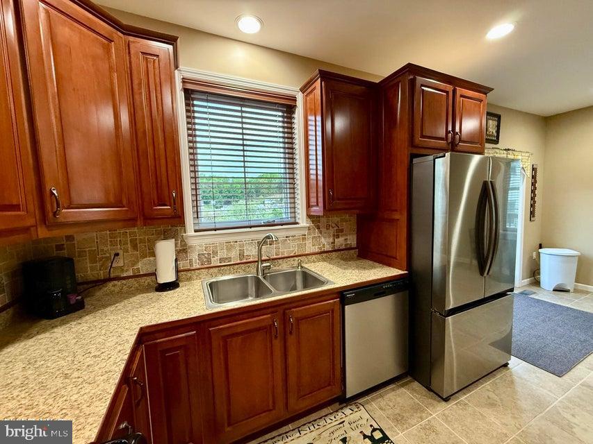 911 Lower Main Street Saxton, PA 16678 - Photo 28 of 63 a kitchen with stainless steel appliances granite countertop a refrigerator and a sink