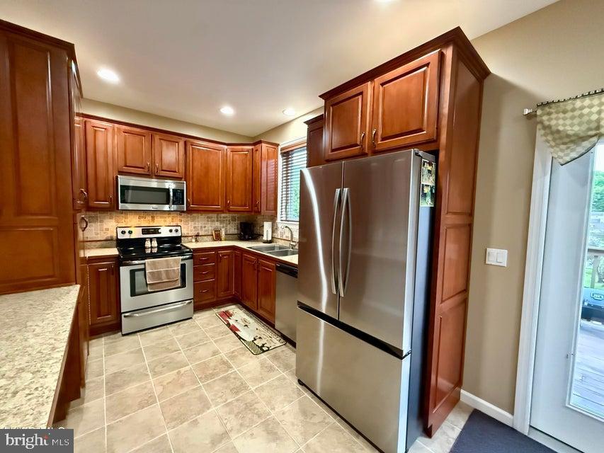 911 Lower Main Street Saxton, PA 16678 - Photo 30 of 63 a kitchen with granite countertop a refrigerator and a sink