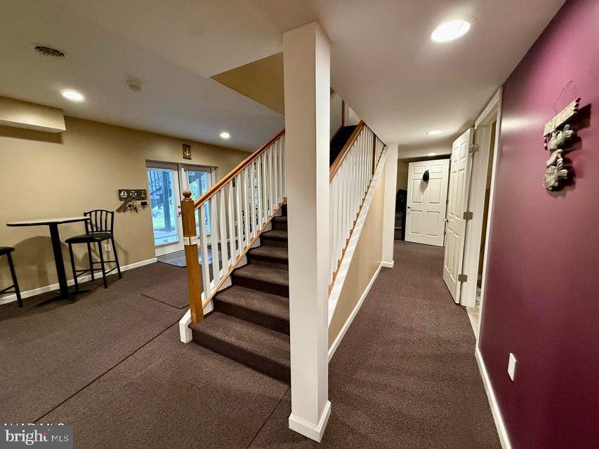 911 Lower Main Street Saxton, PA 16678 - Photo 36 of 63 a view of staircase with lots of frames on wall and stairs