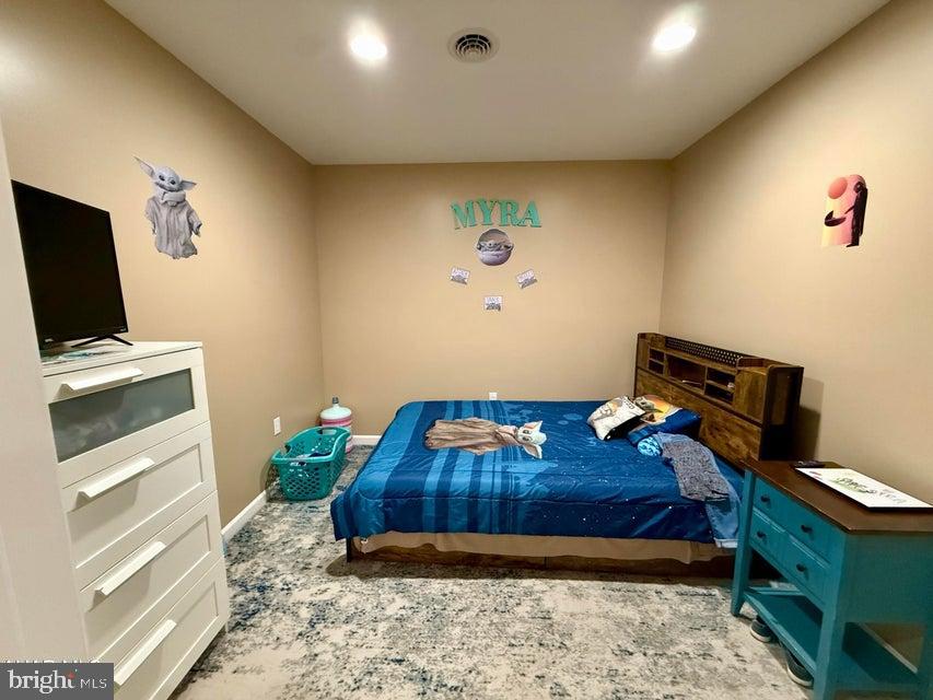 911 Lower Main Street Saxton, PA 16678 - Photo 39 of 63 a bedroom with a bed and a flat screen tv