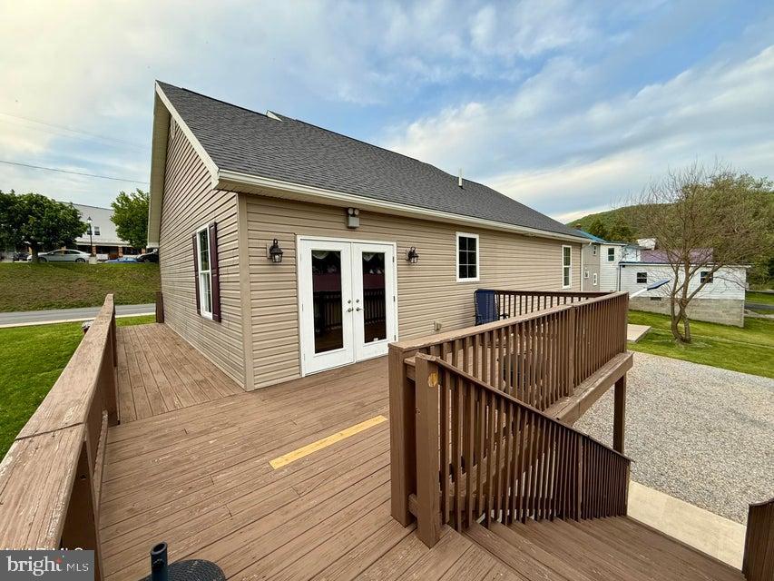 911 Lower Main Street Saxton, PA 16678 - Photo 51 of 63 a terrace of a house with wooden floor next to a yard