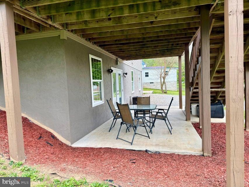 911 Lower Main Street Saxton, PA 16678 - Photo 52 of 63 a view of a dinning table and chairs in patio