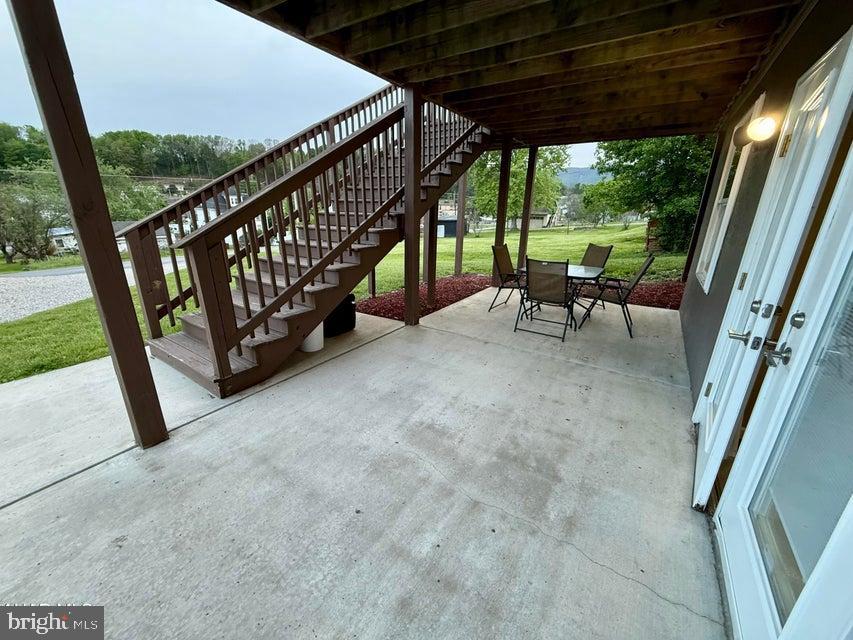 911 Lower Main Street Saxton, PA 16678 - Photo 54 of 63 a view of porch with furniture and garden