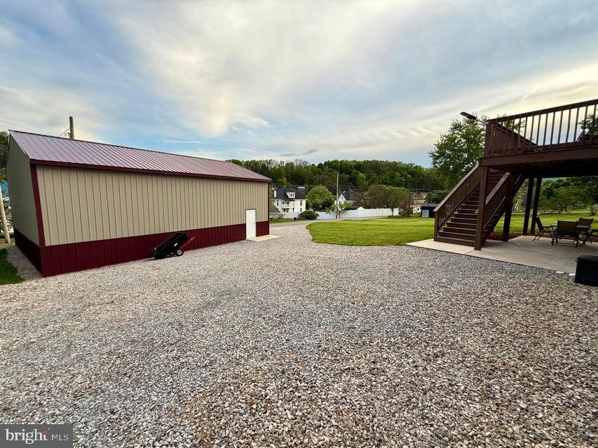 911 Lower Main Street Saxton, PA 16678 - Photo 55 of 63 a view of a house with a yard and sitting area