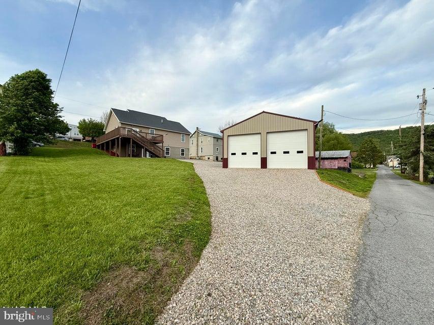 911 Lower Main Street Saxton, PA 16678 - Photo 59 of 63 a view of a house with a big yard and large trees