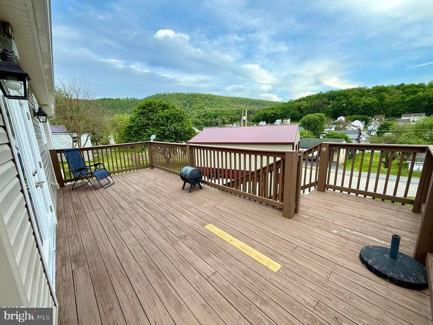 911 Lower Main Street Saxton, PA 16678 - Photo 6 of 63 a view of balcony with wooden floor and fence