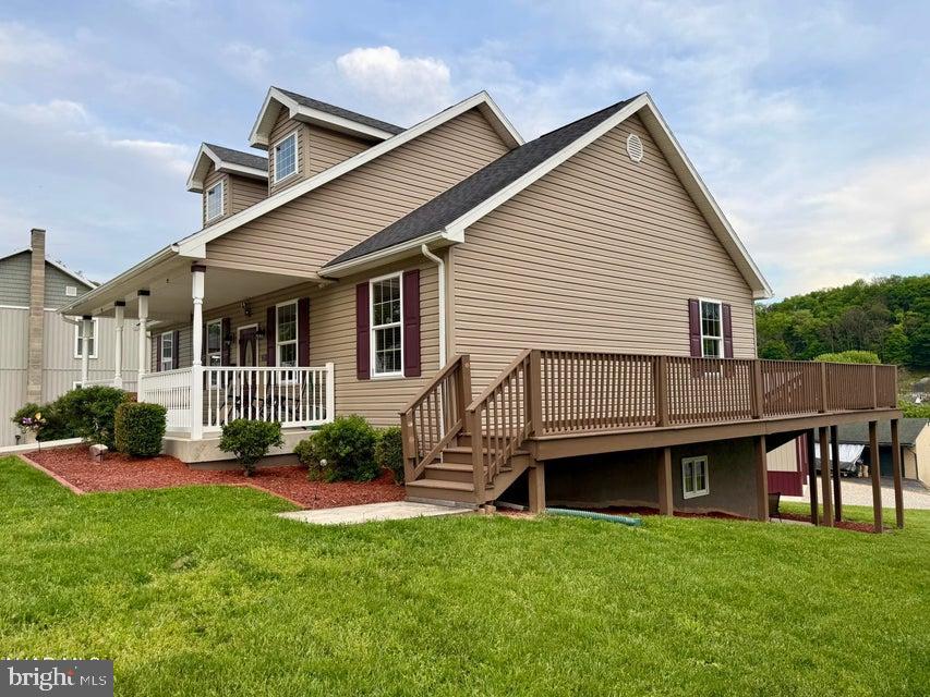 911 Lower Main Street Saxton, PA 16678 - Photo 8 of 63 a view of a house with a backyard and sitting area