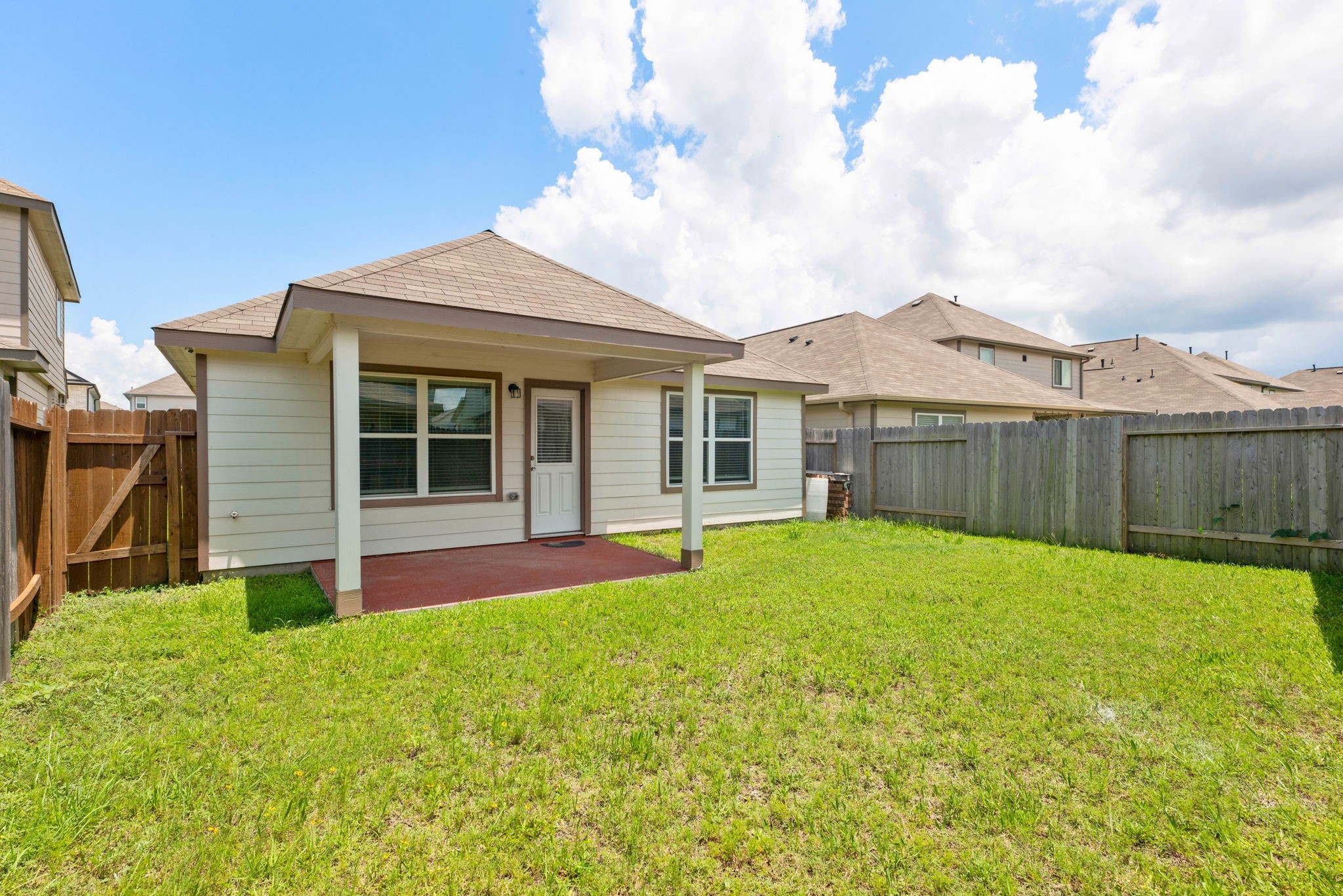 17555 Greystanes Road Humble, TX 77346 - Photo 25 of 28 a view of an house with backyard space and balcony