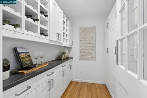a kitchen with cabinets and window