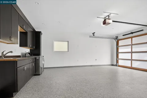 a view of a kitchen with a sink cabinet and a window