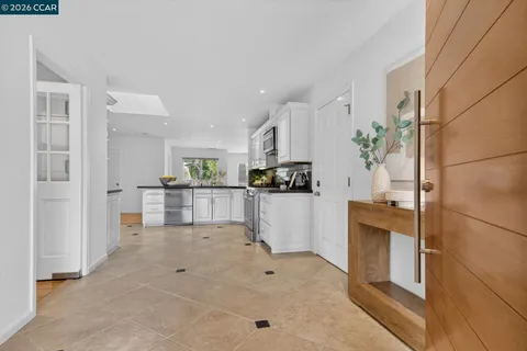 a view of a kitchen with furniture and an oven