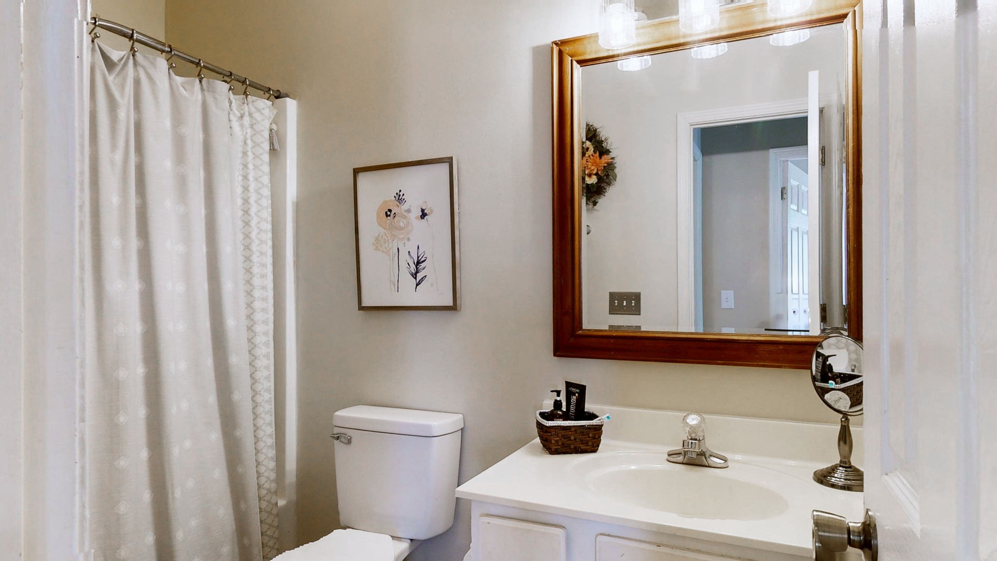 200 Eastside Road Burns, TN 37029 - Photo 22 of 32 a bathroom with a sink a mirror and a toilet