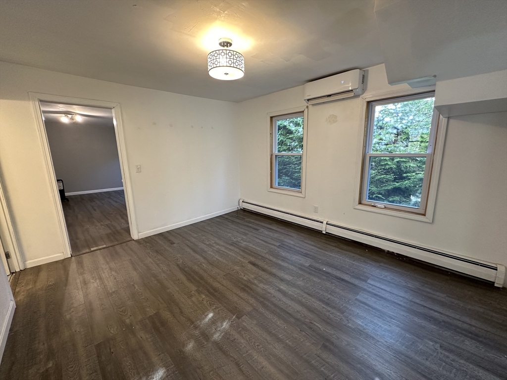 8 Pike Street Hopkinton, MA 01748 - Photo 26 of 34 an empty room with wooden floor and windows