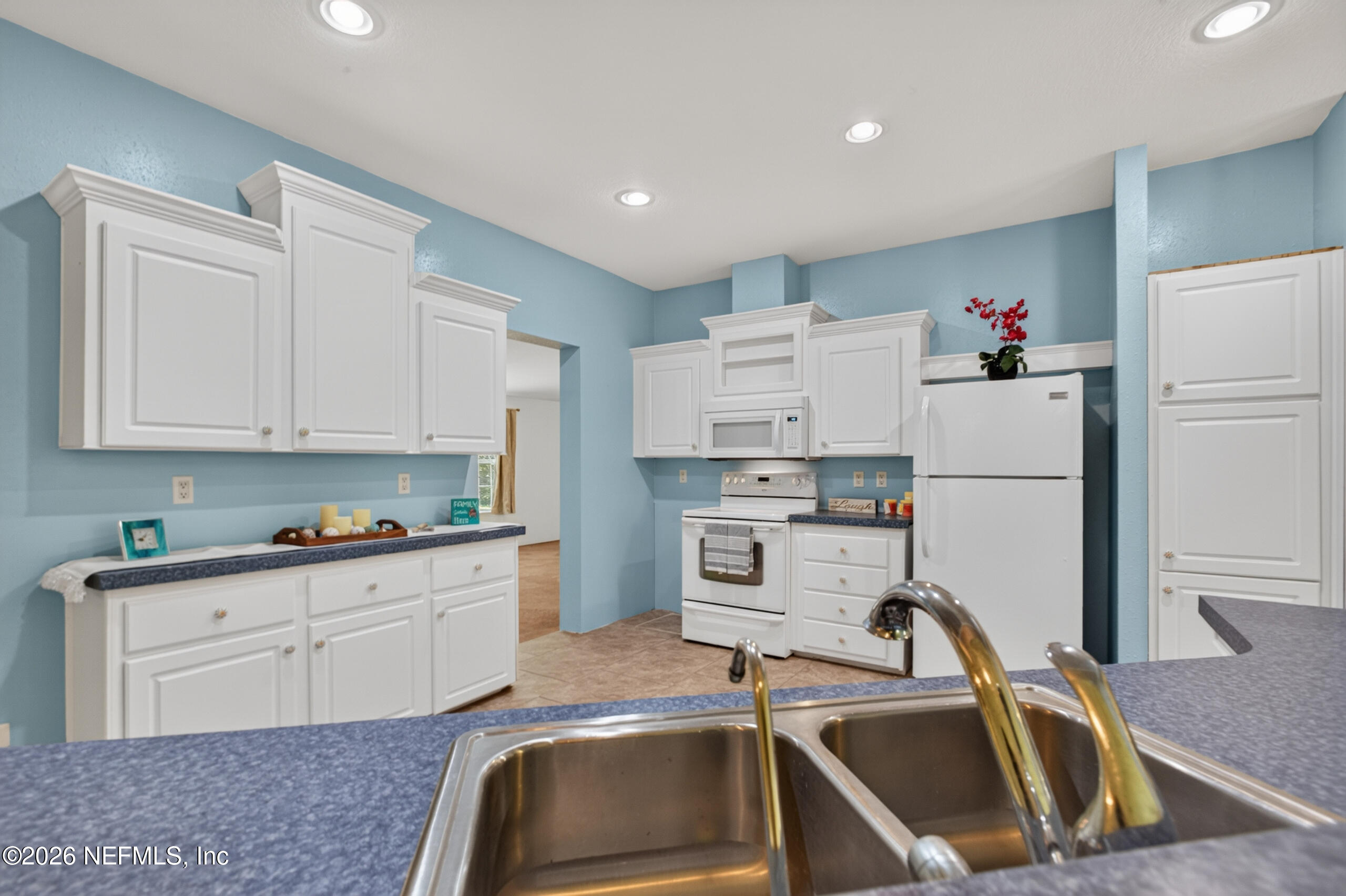 2817 Haddock Road Jacksonville, FL 32218 - Photo 34 of 77 Breakfast Bar Over Sink to Kitchen