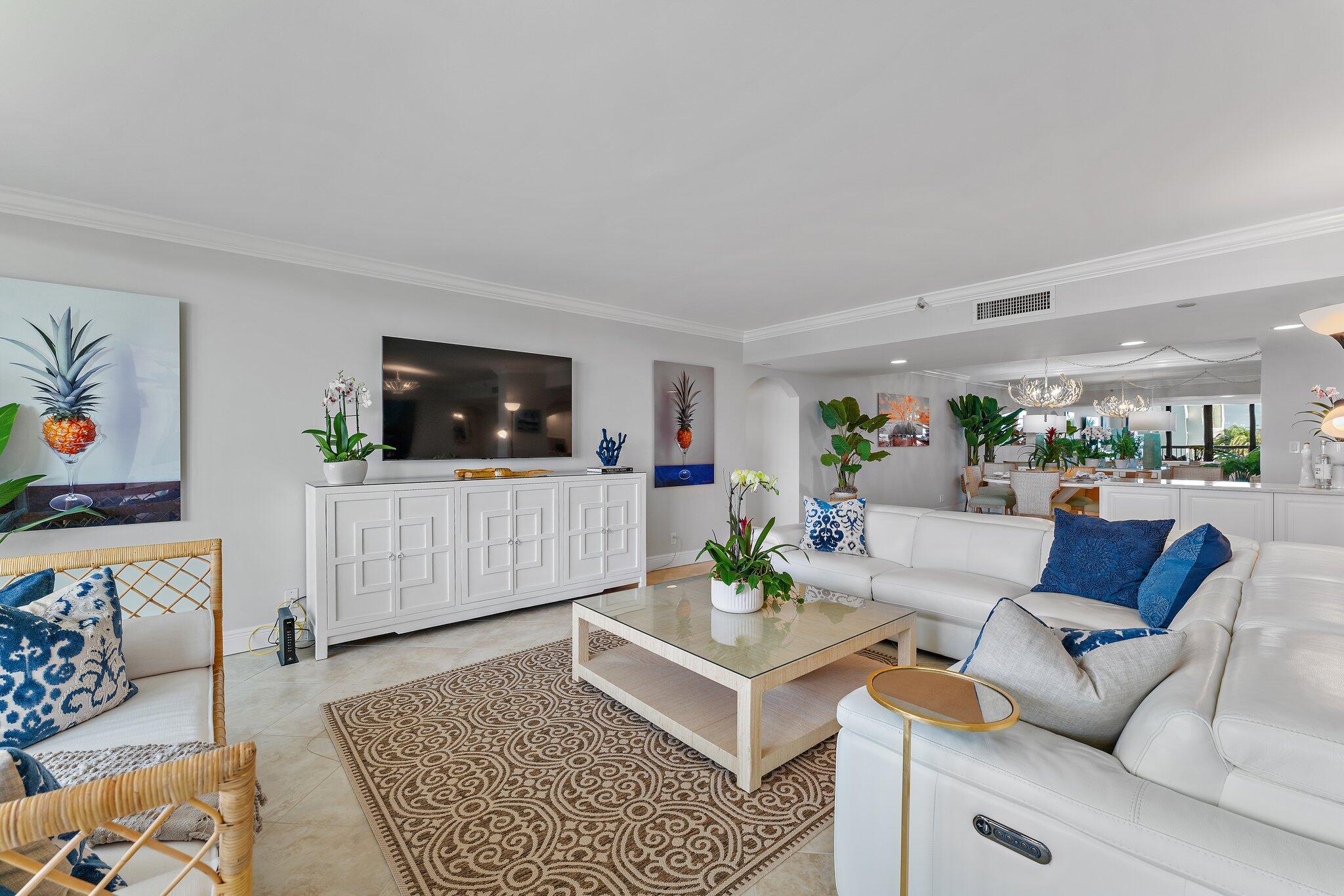 19670 South Beach Road, Unit B303 Jupiter, FL 33469 - Photo 17 of 104 a living room with furniture and a flat screen tv