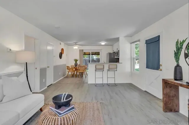a living room with furniture and a table