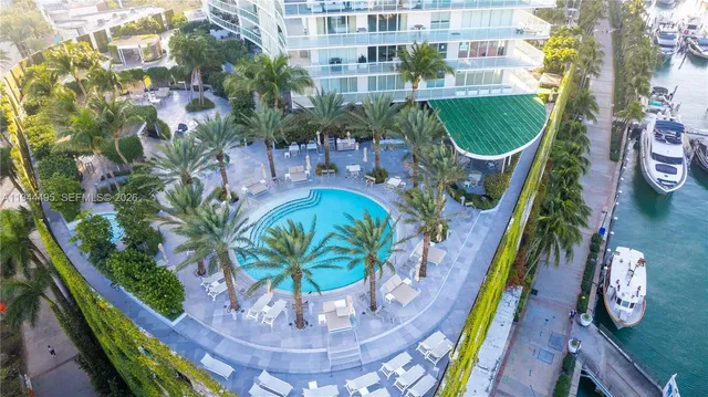a view of a swimming pool with sitting area
