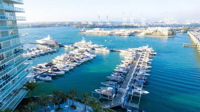 a large body of water with a building in the background