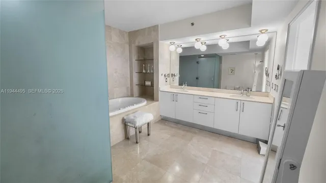 a bathroom with a sink double vanity and a mirror