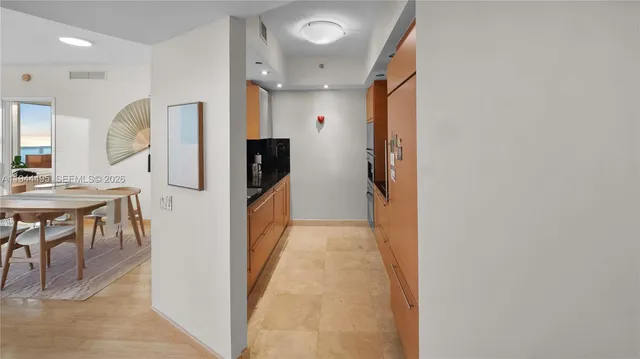 a kitchen with a sink and refrigerator