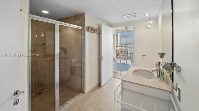 a living room with furniture a large window and a fireplace