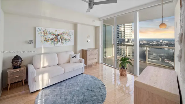 a dining room with lots of furniture and chandelier