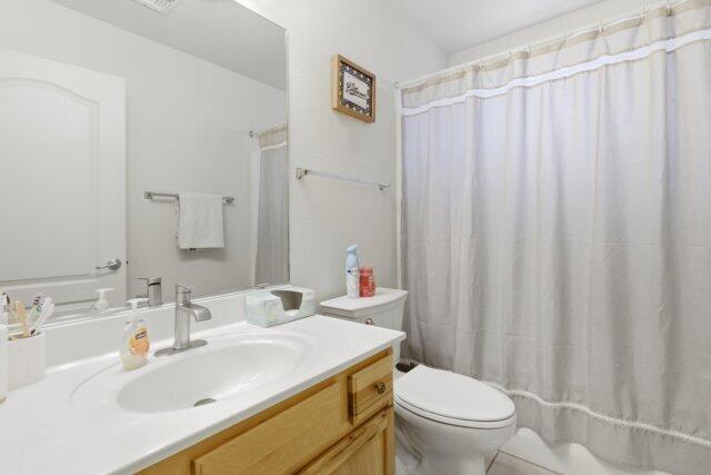 722 Boulder Ridge Road Payson, AZ 85541 - Photo 27 of 29 a bathroom with a sink a toilet and shower curtain
