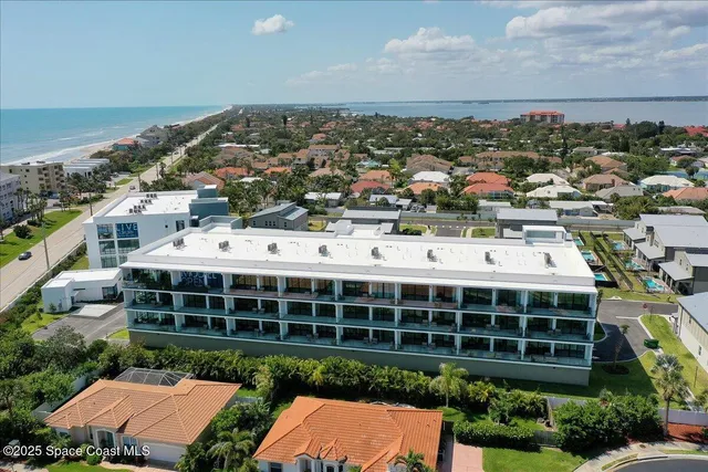 an aerial view of a house with a garden