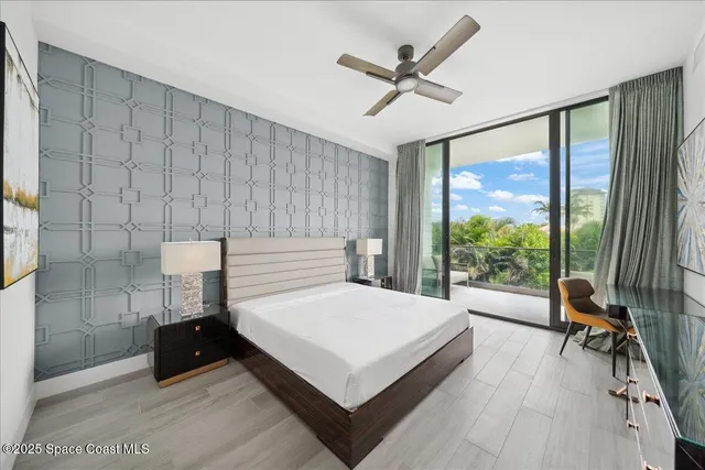 a spacious bedroom with a bed and a dresser