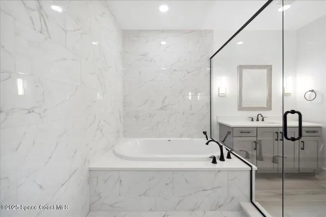 a bathroom with a double vanity sink a mirror and a shower