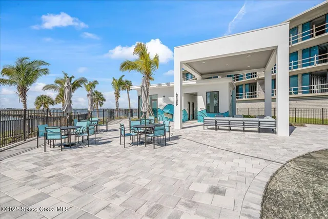 a view of a swimming pool with a yard