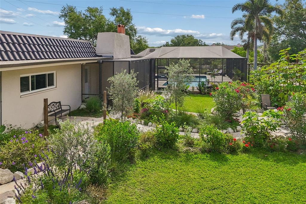 1875 Belleair Road Clearwater, FL 33764 - Photo 95 of 100 a view of a house with a yard and sitting area