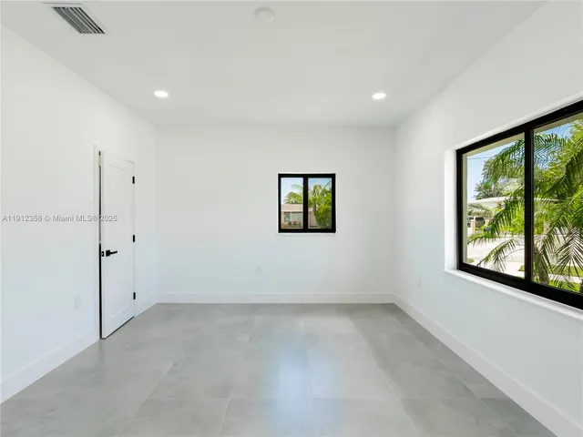 an empty room with windows