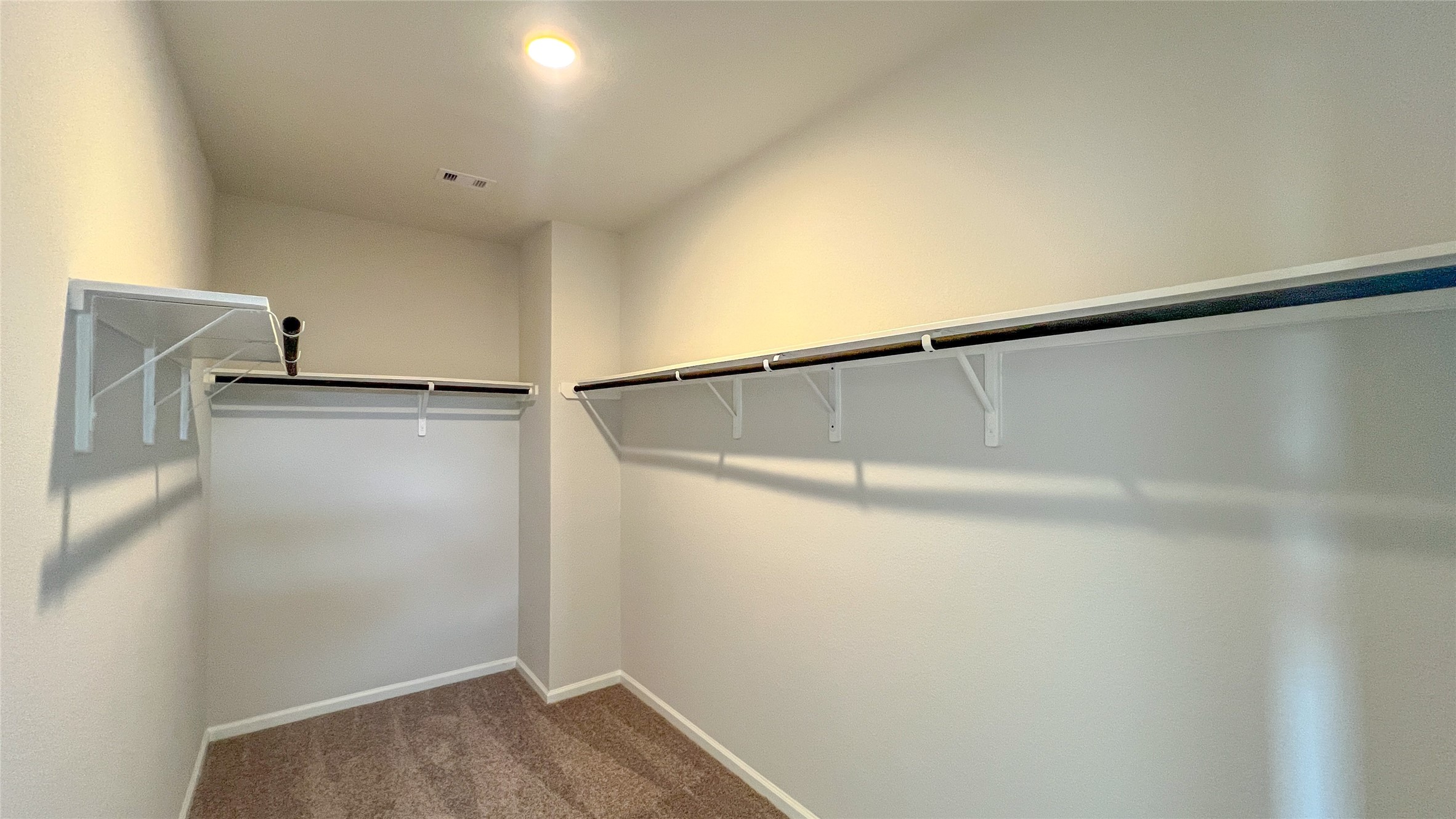 9777 Enclave Ridge Road Willis, TX 77318 - Photo 13 of 19 The Brambling- Primary Suite Closet. Sample floor plan image for illustration; upgrades, options, and colors may vary.
