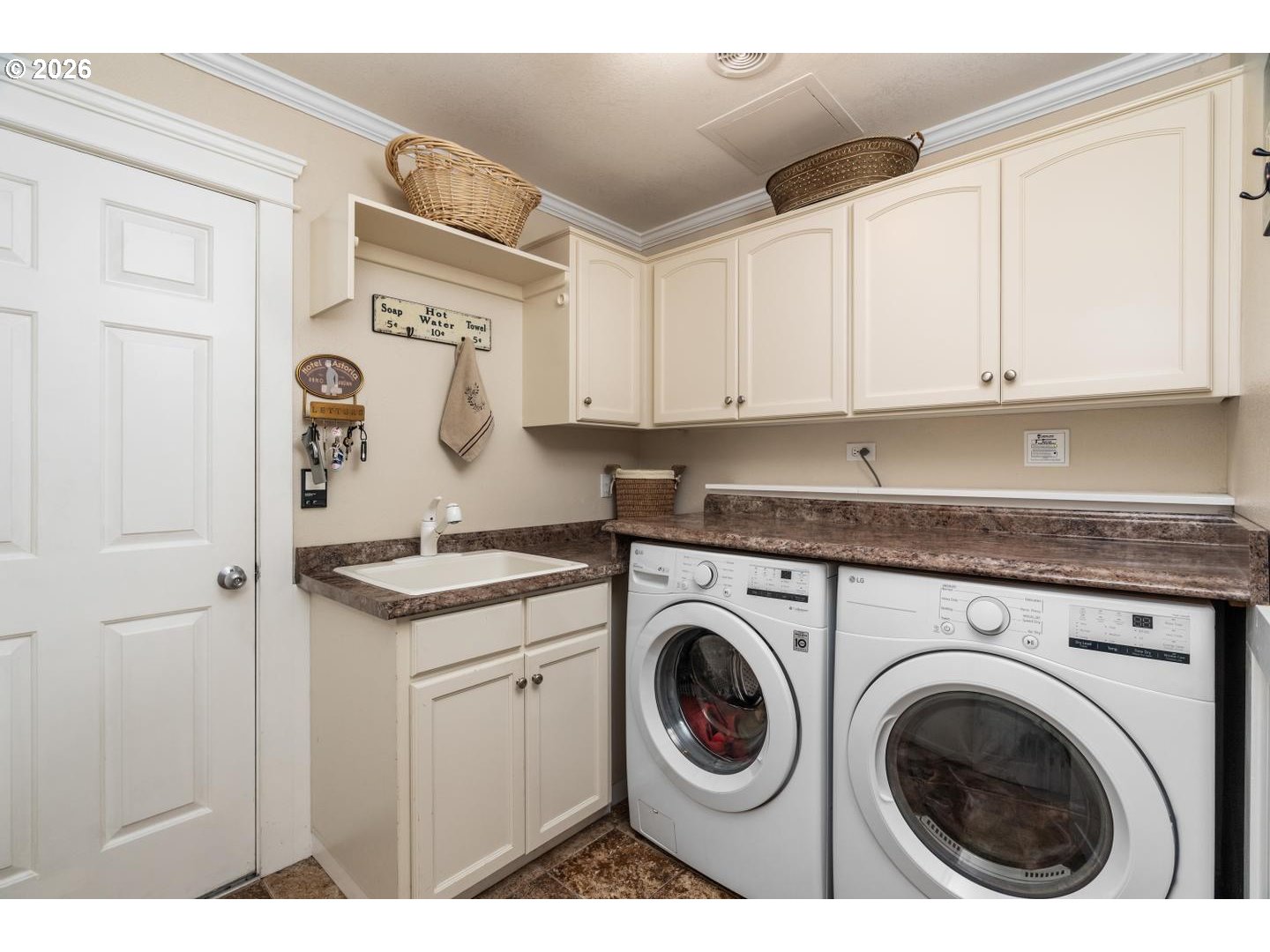 16042 Southwest Waxwing Way Beaverton, OR 97007 - Photo 39 of 48 a utility room with sink dryer and washer
