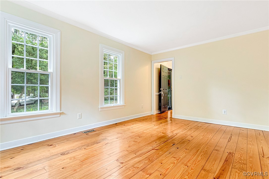 7400 Turner Road Henrico, VA 23231 - Photo 17 of 47 an empty room with wooden floor and windows