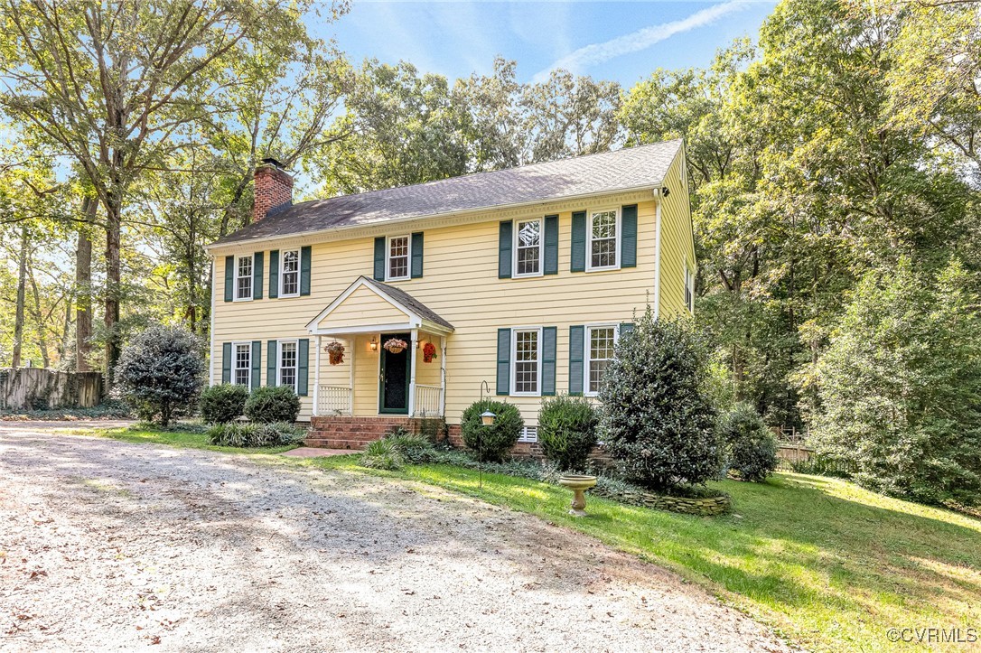 7400 Turner Road Henrico, VA 23231 - Photo 2 of 47 a front view of a house with garden