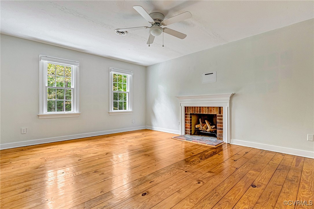 7400 Turner Road Henrico, VA 23231 - Photo 21 of 47 an empty room with windows and a fireplace